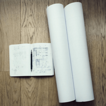 An Image Of An Architects Notebook And Blueprints