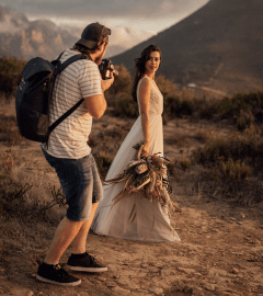 A photographer taking picture of a bride