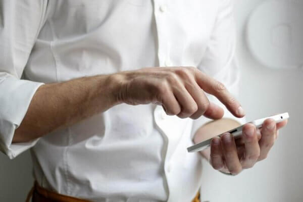 an image of a man using a phone.