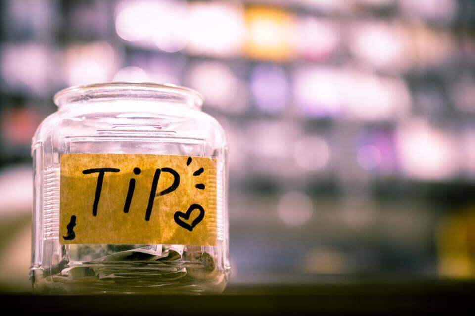 a photo of a jar of tips.