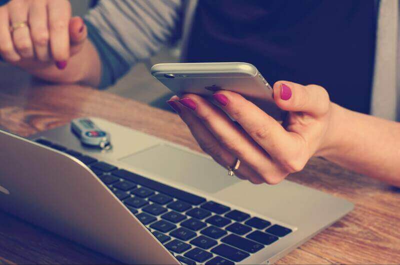 an image of a woman using a mobile phone.